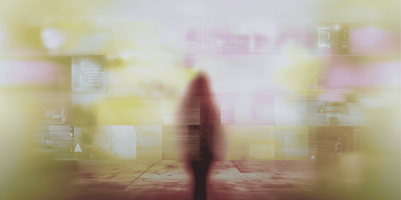 A blurry image of a person walking on a sidewalk.