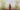 A blurry image of a person walking on a sidewalk.