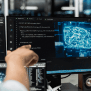 Software developer programming AI code with digital brain visualization on multiple monitors