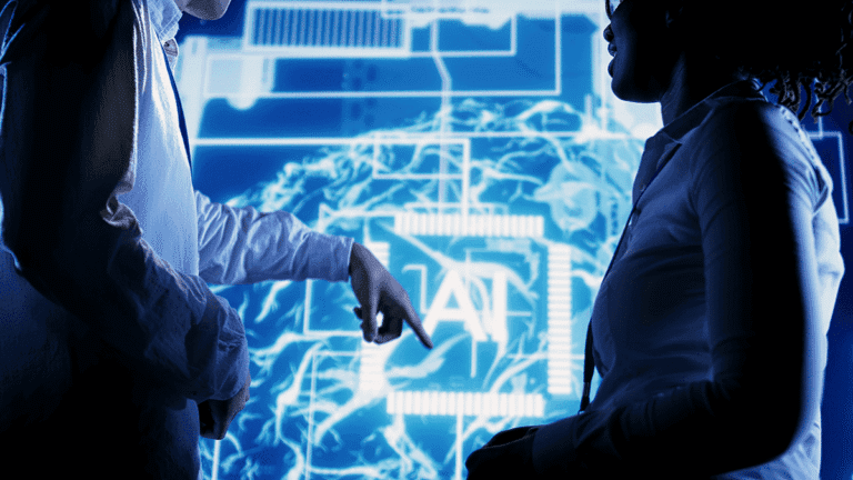 two business professionals analyzing data visualization and charts on large digital screen