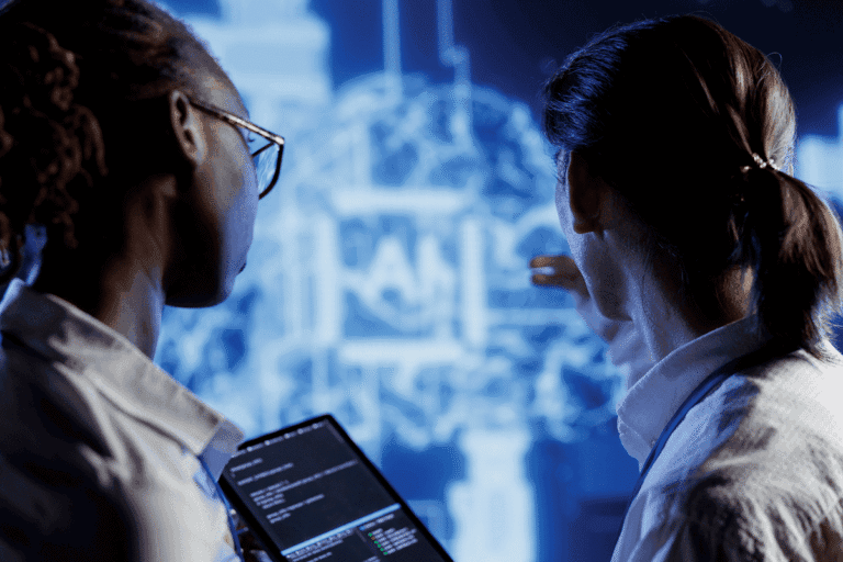 two medical professionals analyzing brain mri scan with ai diagnostic software on tablet device