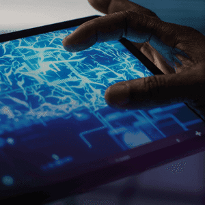 hands interacting with digital circuit board interface on tablet touchscreen displaying technology network