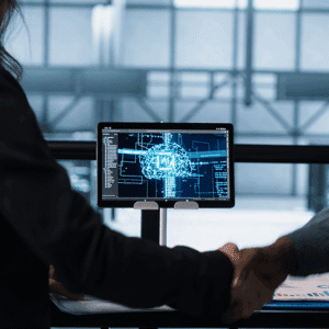 two professionals analyzing artificial intelligence brain visualization on computer monitor in modern office