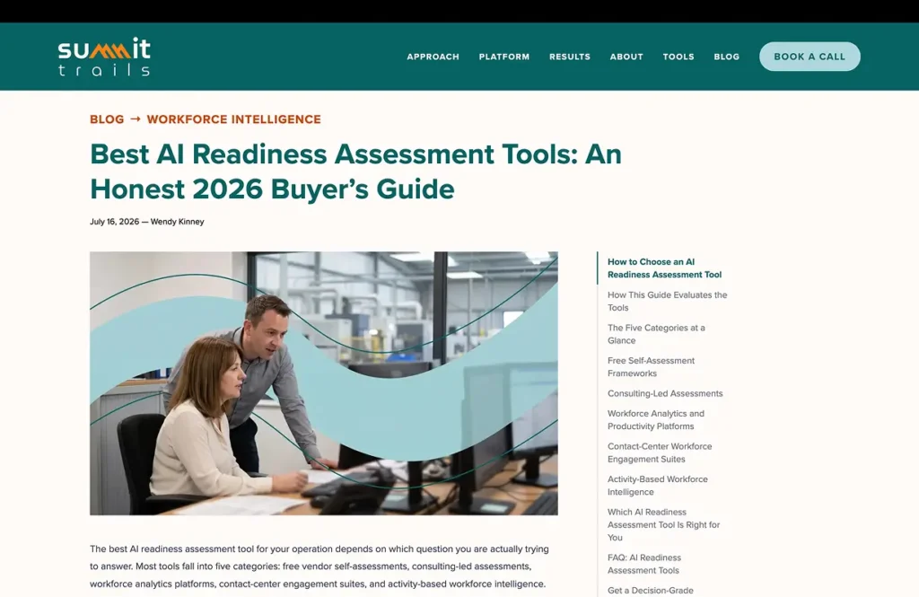 two colleagues review documents at a desk in a bright office, with teal curved graphics overlaid on the photo.