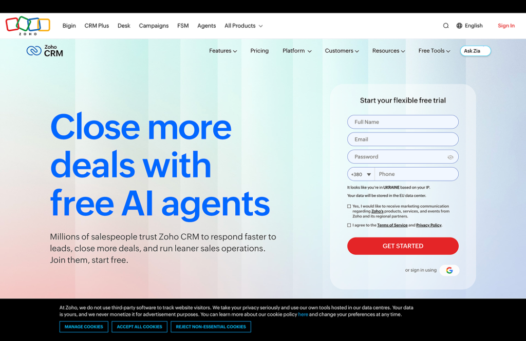 Zoho - Teamvoy hero banner for zoho crm: large blue headline'Close more deals with free AI agents' on a light gradient background, with a right-side rounded signup form and a cookie consent bar at the bottom.