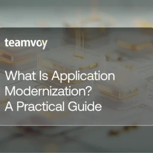 hero banner with teamvoy logo and the title 'what is application modernization? a practical guide' over a blurred circuit-board background.